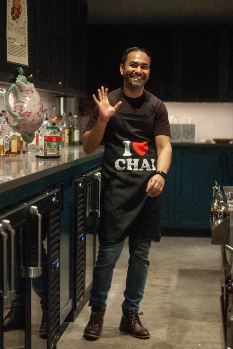 Rajiv Roy in an I love chai apron