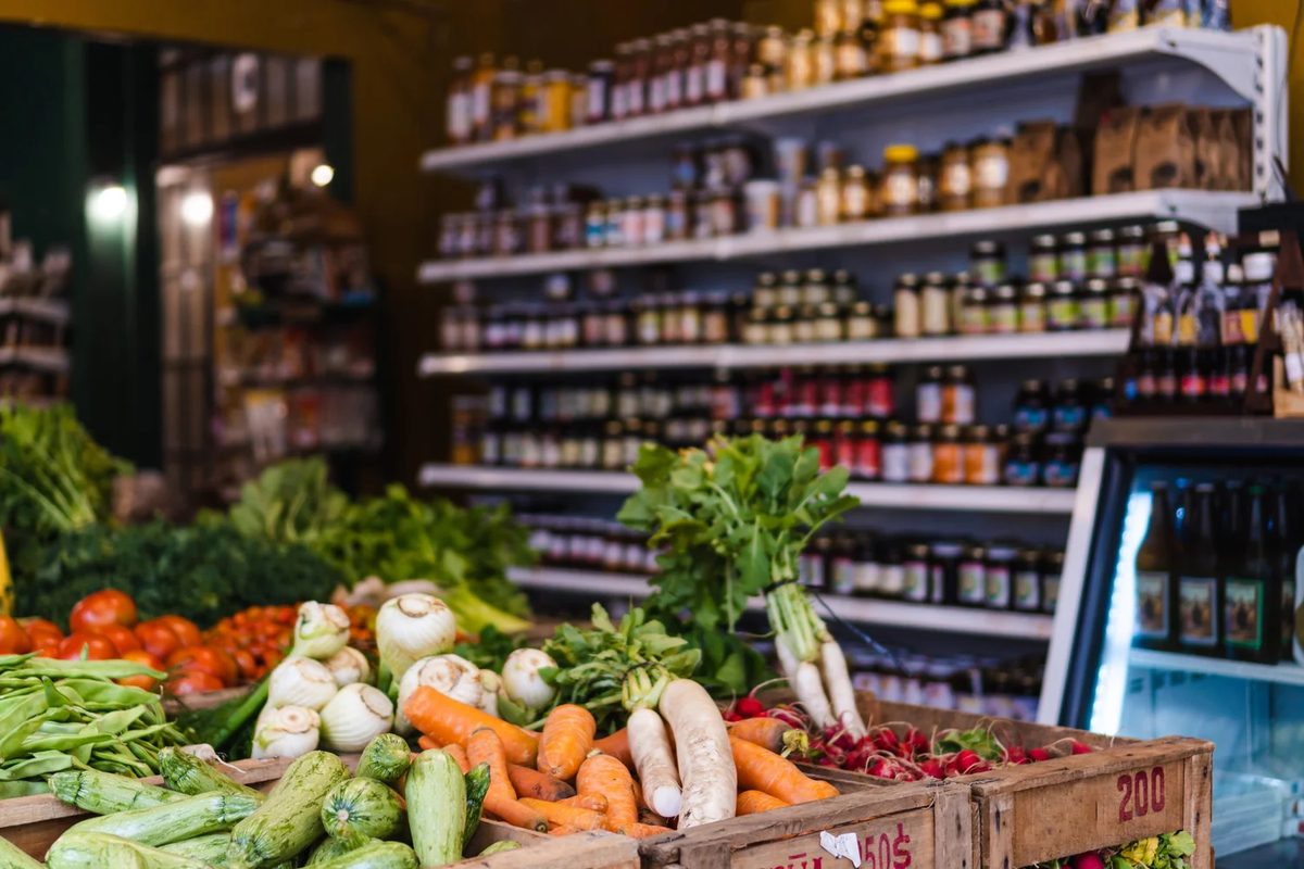Fresh produce and pantry shelves inside a neighborhood market